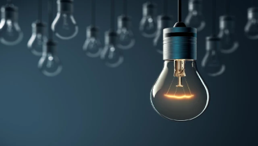 light bulbs handing in front of a dark background